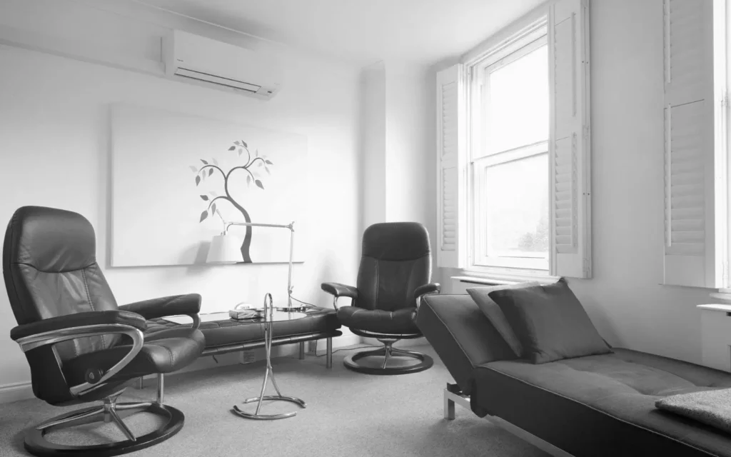 Therapy room in London with chairs and a couch